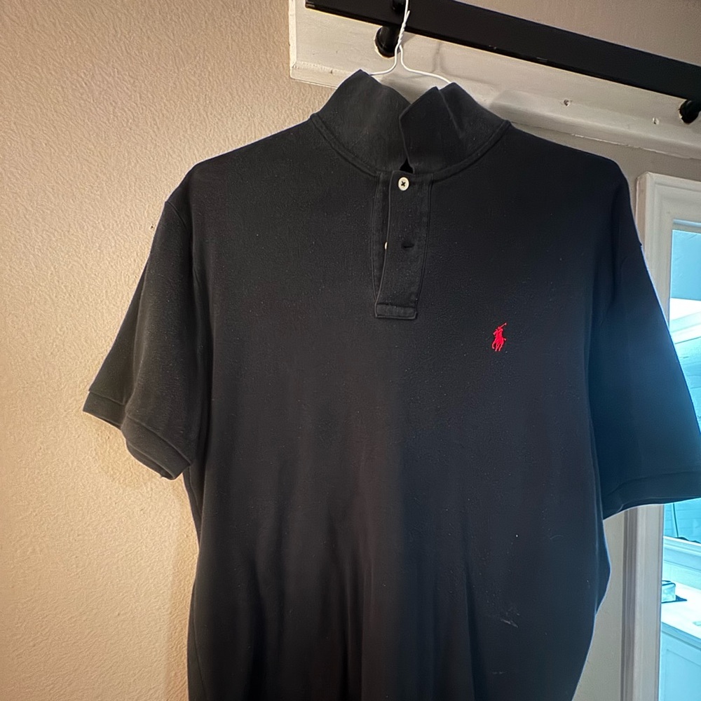 Large black polo. No stains or rips. Good condition